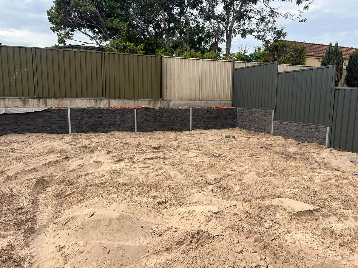 Who is responsible for a retaining wall on a boundary line